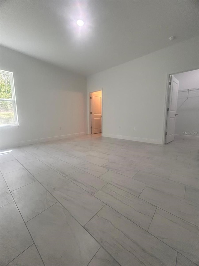 9451 N Emellia Ave, Citrus Springs, FL 34433 - unfurnished room with baseboards and a smoke detector