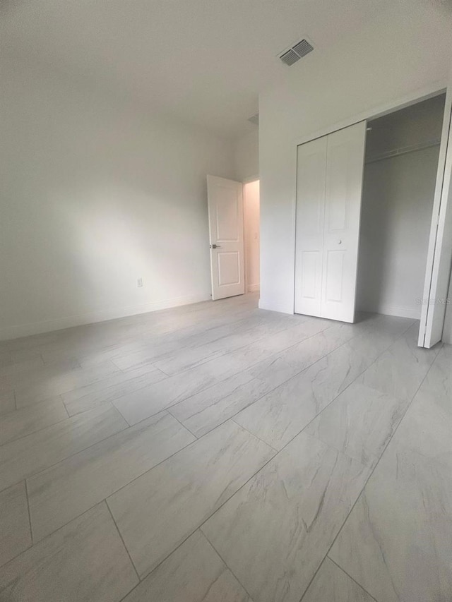 9451 N Emellia Ave, Citrus Springs, FL 34433 - unfurnished bedroom with a closet
