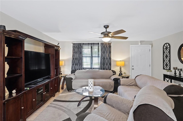 living room featuring a ceiling fan and light tile patterned floors