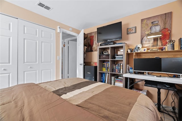 bedroom featuring a closet and visible vents