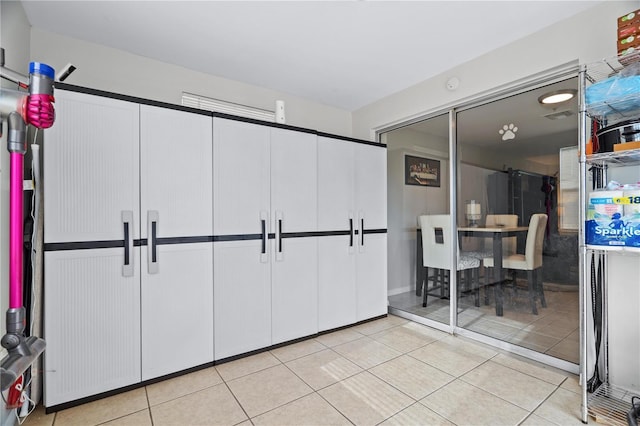 interior space with light tile patterned floors