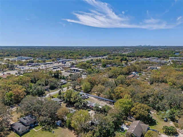 drone / aerial view featuring a wooded view