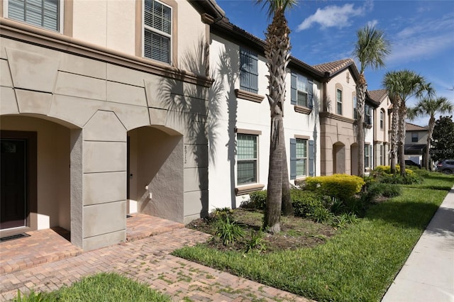 view of property exterior featuring a residential view and stucco siding