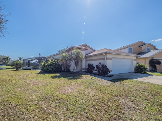 view of front of house with an attached garage, a front lawn, concrete driveway, and stucco siding