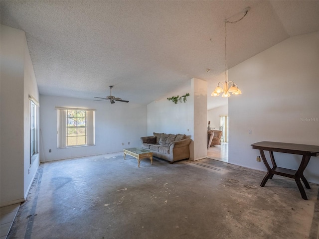 sitting room featuring a textured ceiling, ceiling fan with notable chandelier, lofted ceiling, and unfinished concrete floors