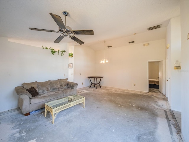 unfurnished living room featuring visible vents, vaulted ceiling, concrete flooring, and ceiling fan with notable chandelier