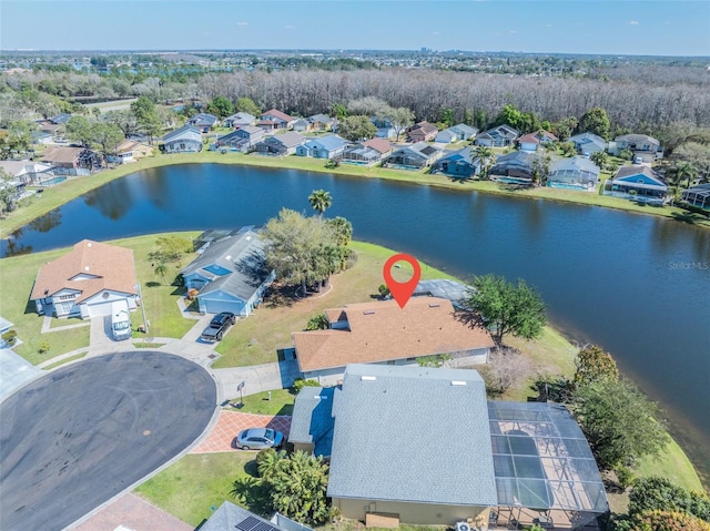 bird's eye view featuring a water view and a residential view