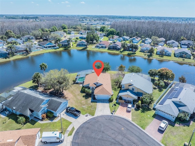 drone / aerial view featuring a water view and a residential view