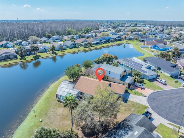 drone / aerial view featuring a water view and a residential view