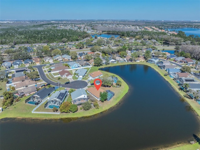 drone / aerial view featuring a water view and a residential view