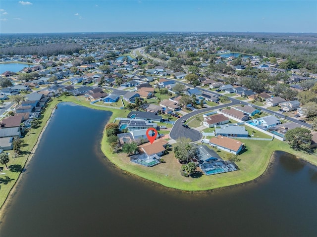 bird's eye view featuring a water view and a residential view