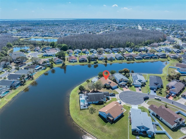 bird's eye view featuring a residential view and a water view