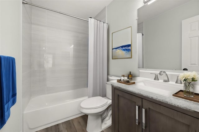 full bath featuring vanity, shower / bathtub combination with curtain, toilet, and wood finished floors