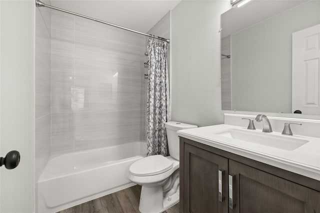 bathroom with toilet, shower / bath combination with curtain, wood finished floors, and vanity