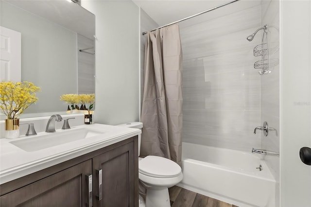 full bathroom with shower / tub combo with curtain, vanity, toilet, and wood finished floors