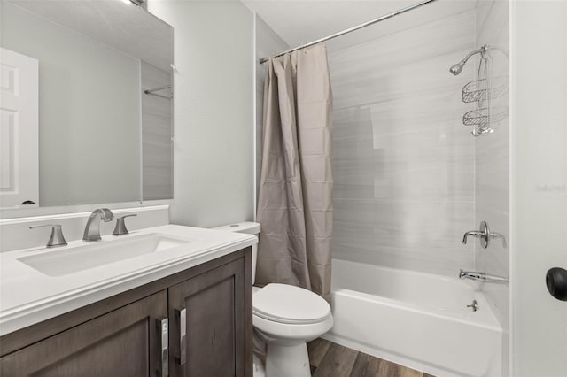 full bathroom featuring toilet, vanity, shower / bath combination with curtain, and wood finished floors