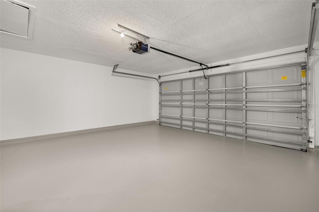 garage featuring baseboards and a garage door opener