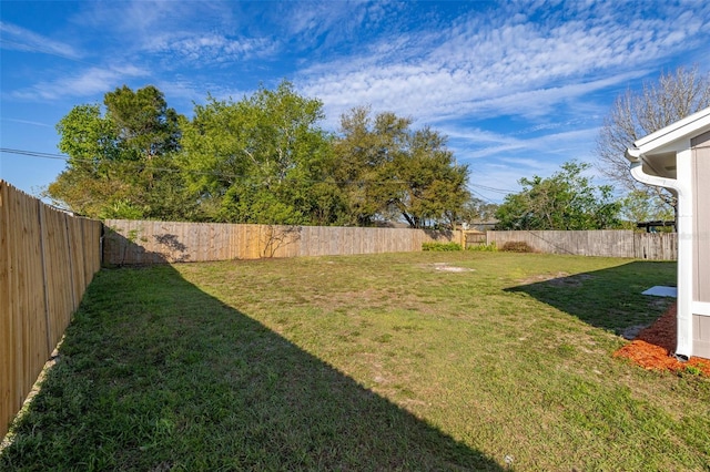 view of yard with a fenced backyard