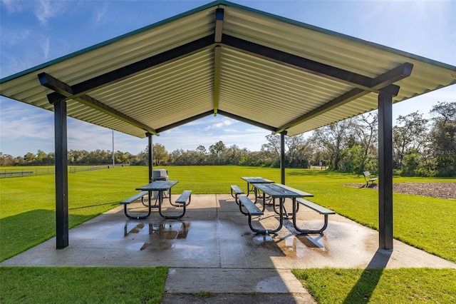 view of home's community featuring a patio area and a yard