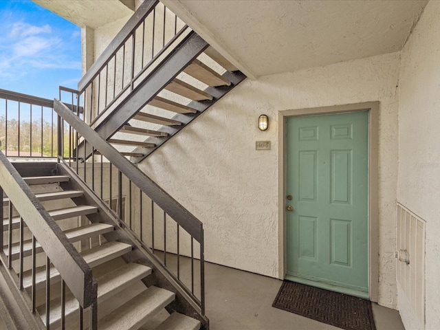 property entrance featuring stucco siding