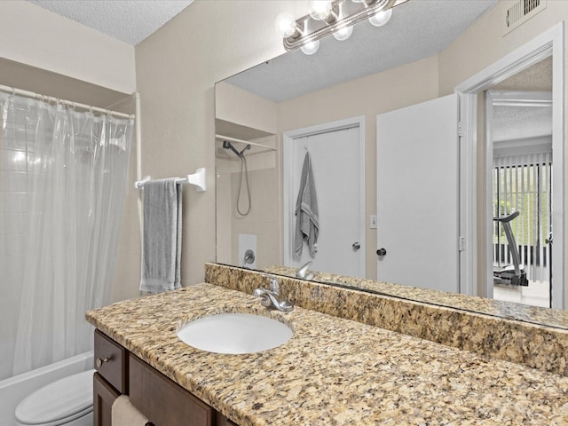 full bathroom with toilet, shower / bath combination with curtain, a textured ceiling, and vanity