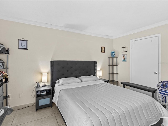 bedroom with light tile patterned floors, ornamental molding, and baseboards