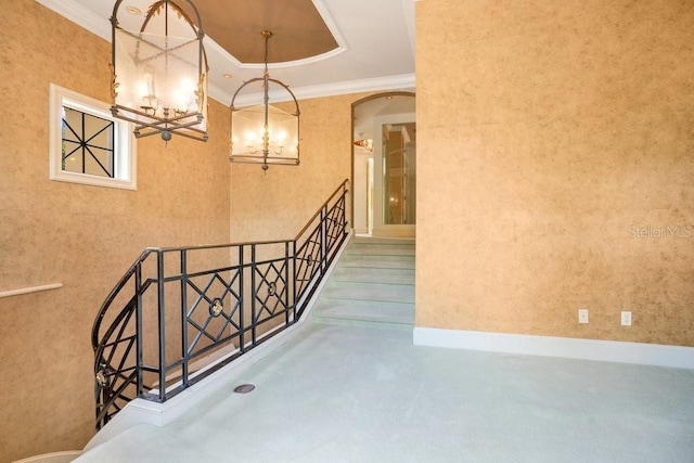 1400 Alabama Dr, Winter Park, FL 32789 - staircase with concrete flooring, ornamental molding, arched walkways, and an inviting chandelier