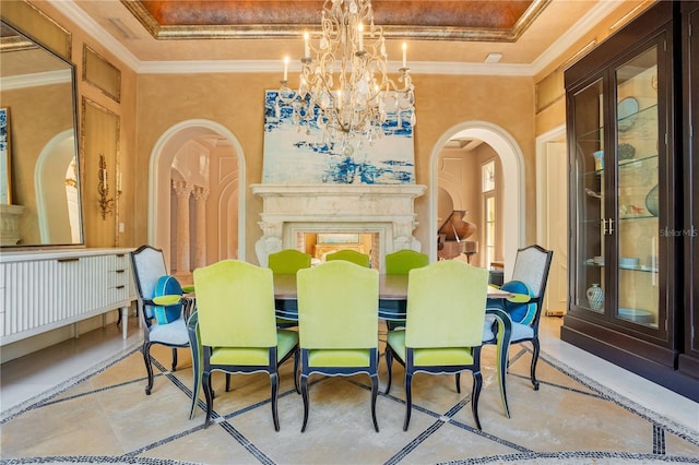 1400 Alabama Dr, Winter Park, FL 32789 - dining space with arched walkways, a notable chandelier, a tray ceiling, and ornamental molding