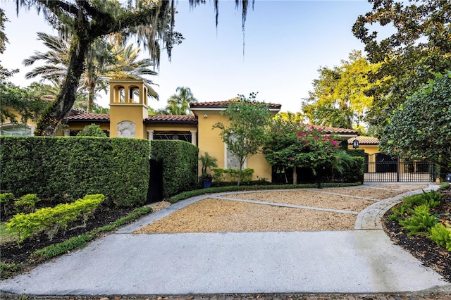 1400 Alabama Dr, Winter Park, FL 32789 - view of front facade with stucco siding, fence, and a tile roof