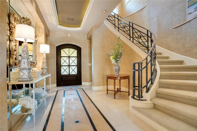 1400 Alabama Dr, Winter Park, FL 32789 - foyer entrance with baseboards, arched walkways, and stairs