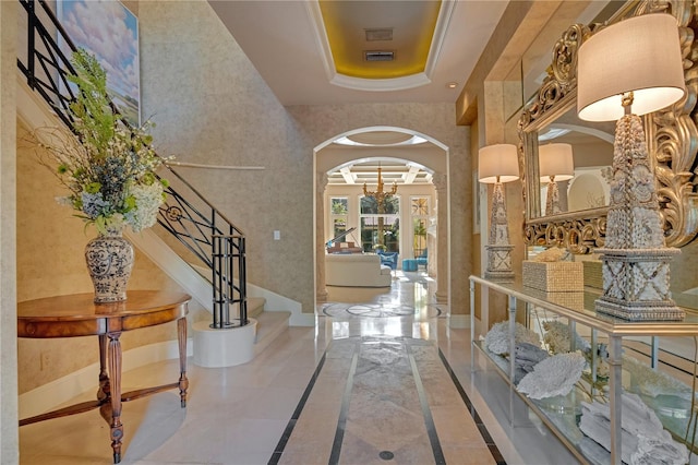 1400 Alabama Dr, Winter Park, FL 32789 - foyer with arched walkways, stairway, visible vents, and baseboards