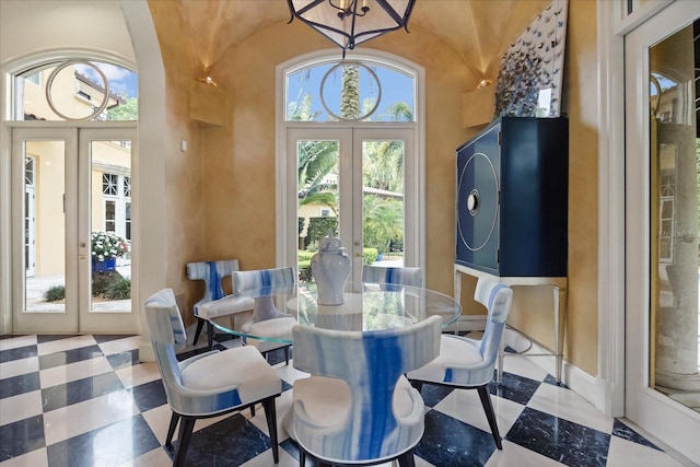 1400 Alabama Dr, Winter Park, FL 32789 - dining area featuring tile patterned floors, french doors, and lofted ceiling