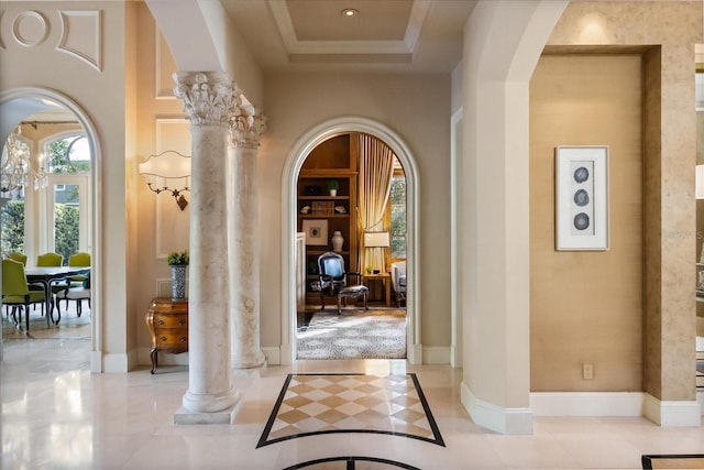 1400 Alabama Dr, Winter Park, FL 32789 - hallway featuring a raised ceiling, arched walkways, decorative columns, and baseboards