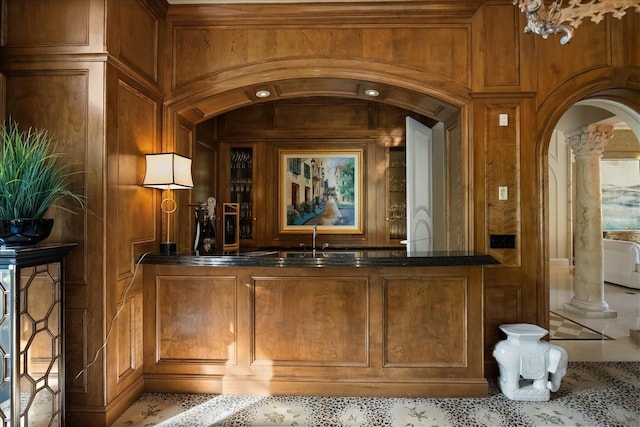 1400 Alabama Dr, Winter Park, FL 32789 - bar with a sink, ornate columns, arched walkways, and wooden walls
