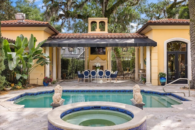 1400 Alabama Dr, Winter Park, FL 32789 - view of pool with french doors, an in ground hot tub, and a patio