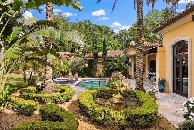 1400 Alabama Dr, Winter Park, FL 32789 - view of pool featuring a patio area, french doors, and a pool with connected hot tub