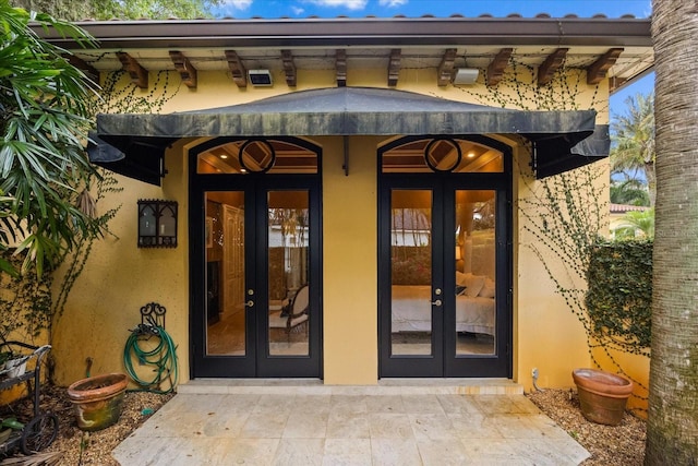 1400 Alabama Dr, Winter Park, FL 32789 - doorway to property featuring french doors and stucco siding
