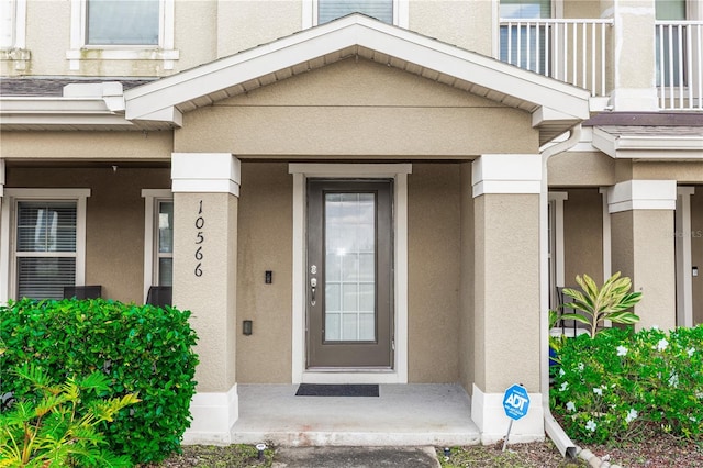 doorway to property with stucco siding