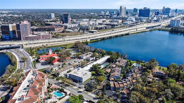 birds eye view of property featuring a water view and a city view