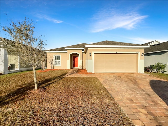 ranch-style home with a shingled roof, decorative driveway, an attached garage, and stucco siding