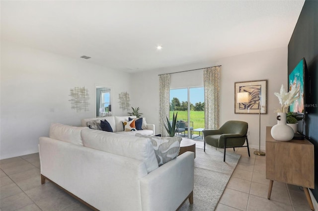 living room with light tile patterned floors and visible vents