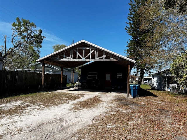 exterior space with driveway and fence