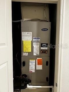 utility room featuring heating unit