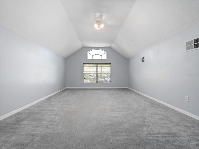 bonus room featuring baseboards, visible vents, and vaulted ceiling