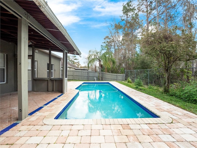 view of pool featuring a fenced backyard, a fenced in pool, and a patio