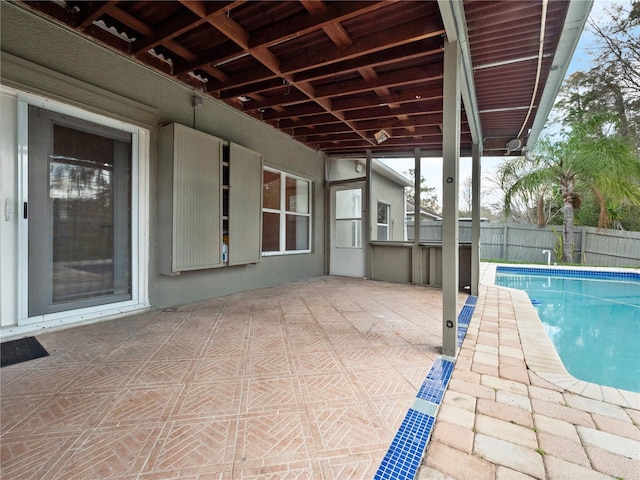 view of pool featuring a patio area, fence, and a fenced in pool