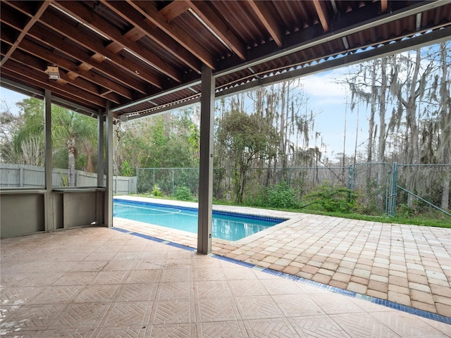 view of swimming pool featuring a patio area, a fenced backyard, and a fenced in pool