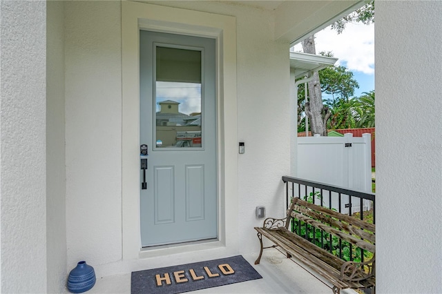 property entrance featuring stucco siding