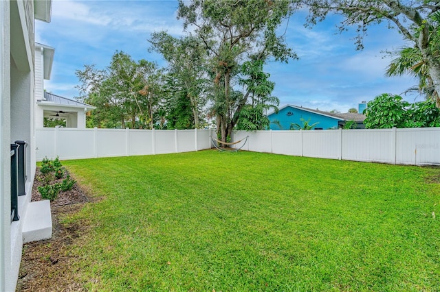 view of yard with a fenced backyard