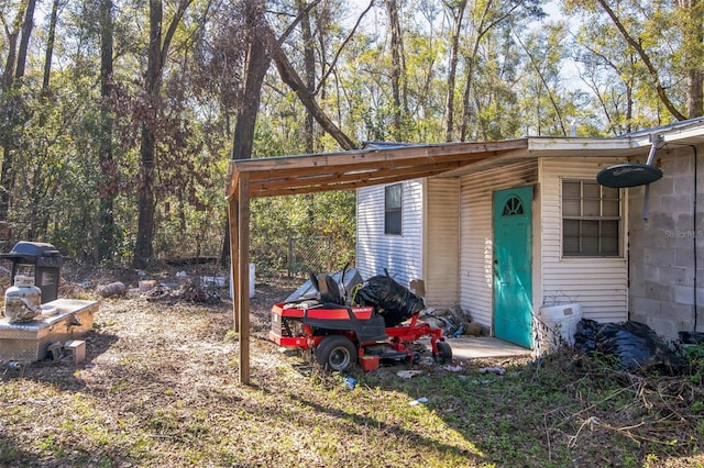 exterior space with a carport